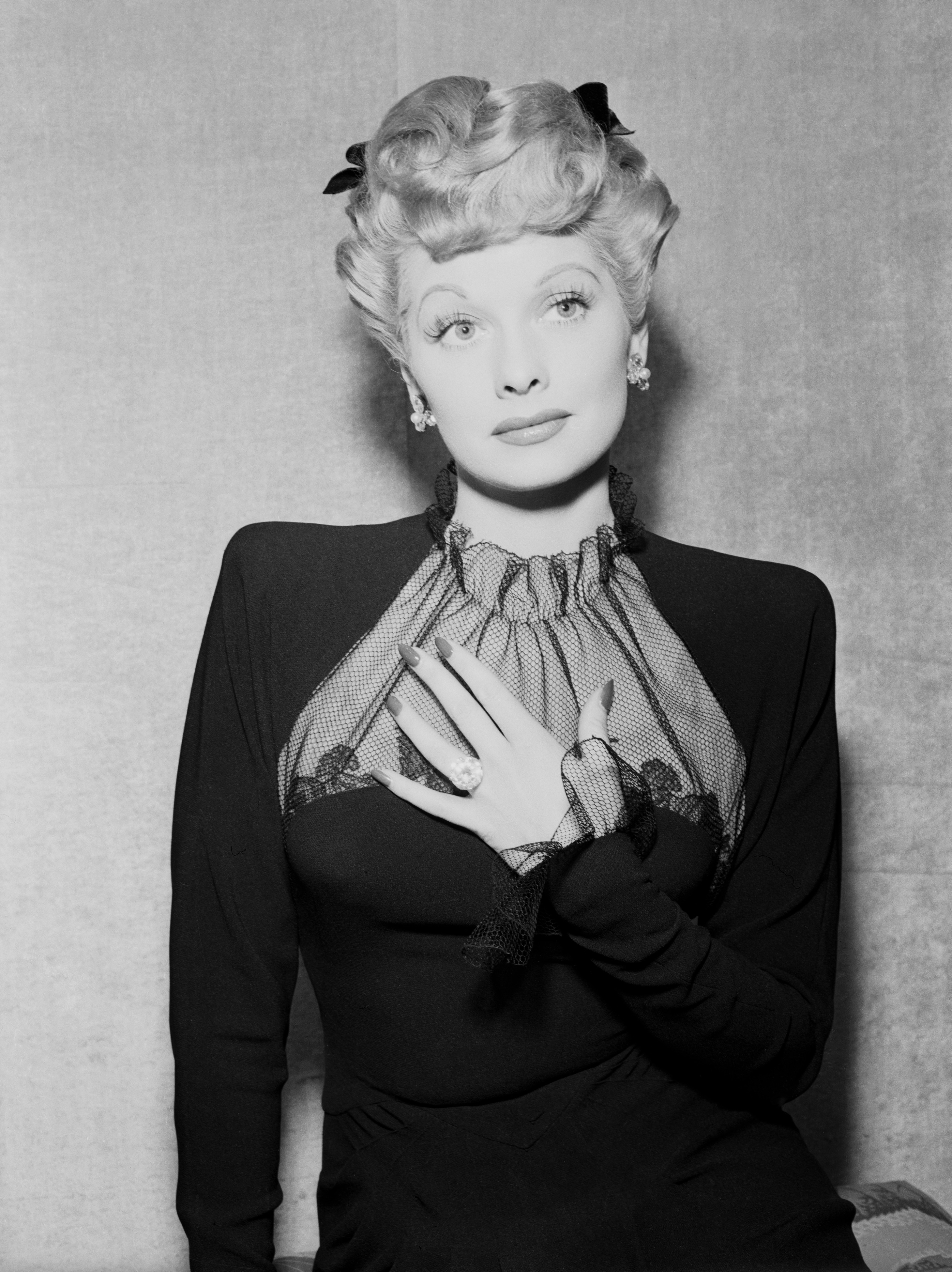 08 Oct 1943 --- Original caption: Lucille Ball, who was currently starring in MGM's Meet The People," was married to Desi Arnaz, who was later in the Army. With marriages then expected to reach an all time high of 2,000,000 in 1943, public interest in engagement and marriage rings was correspondingly high. Lucille Ball is shown wearing the ring chosen by herself as a Hollywood bride to be. --- Image by © Bettmann/CORBIS